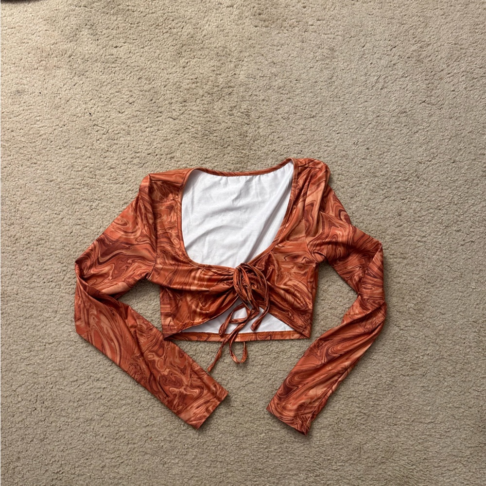 Orange cropped long sleeve top. Never worn